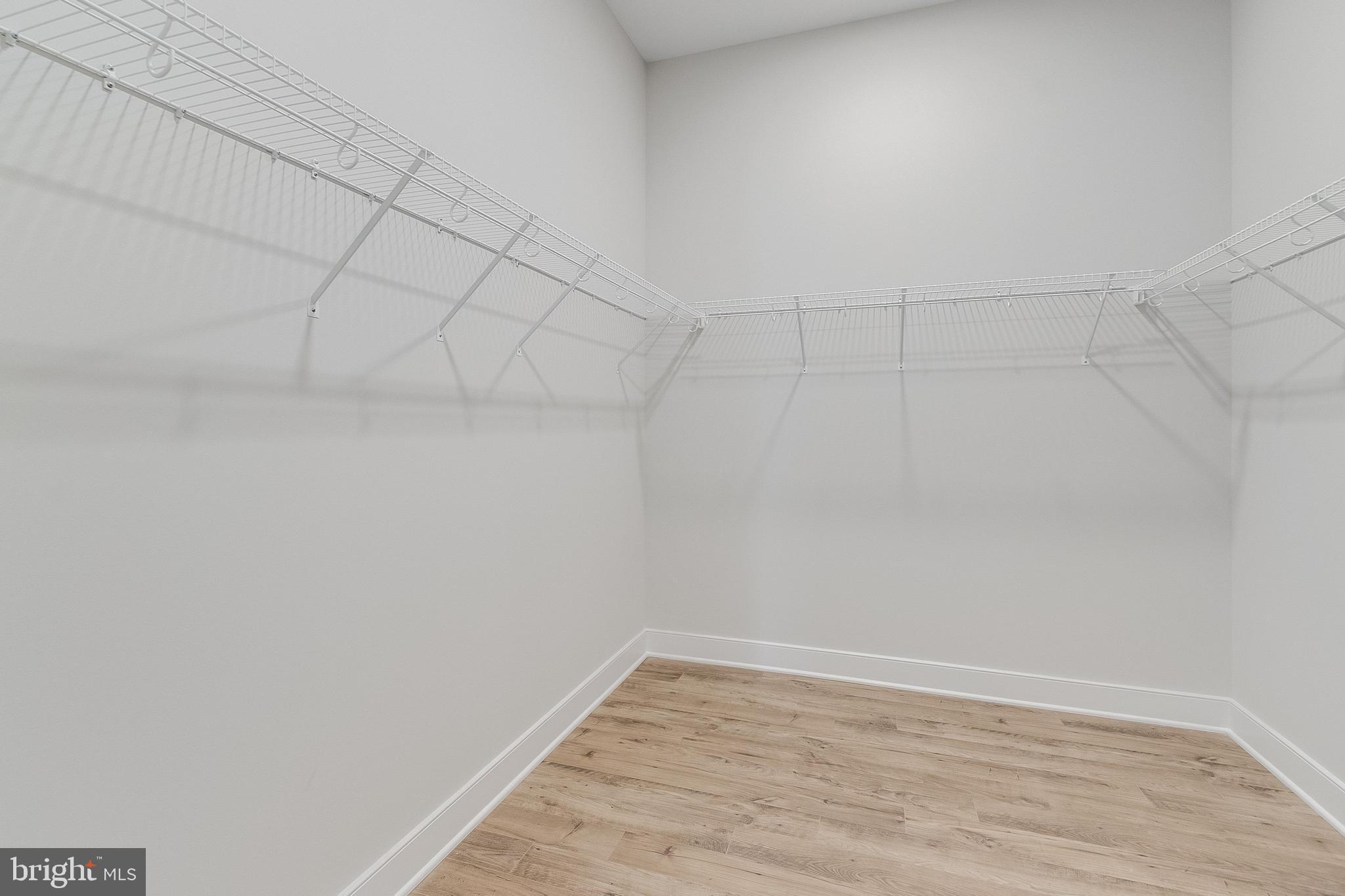 37828 Cedar Road Selbyville, DE 19975 - Photo 57 of 109 Main Level Owner's Suite Walk-In Closet