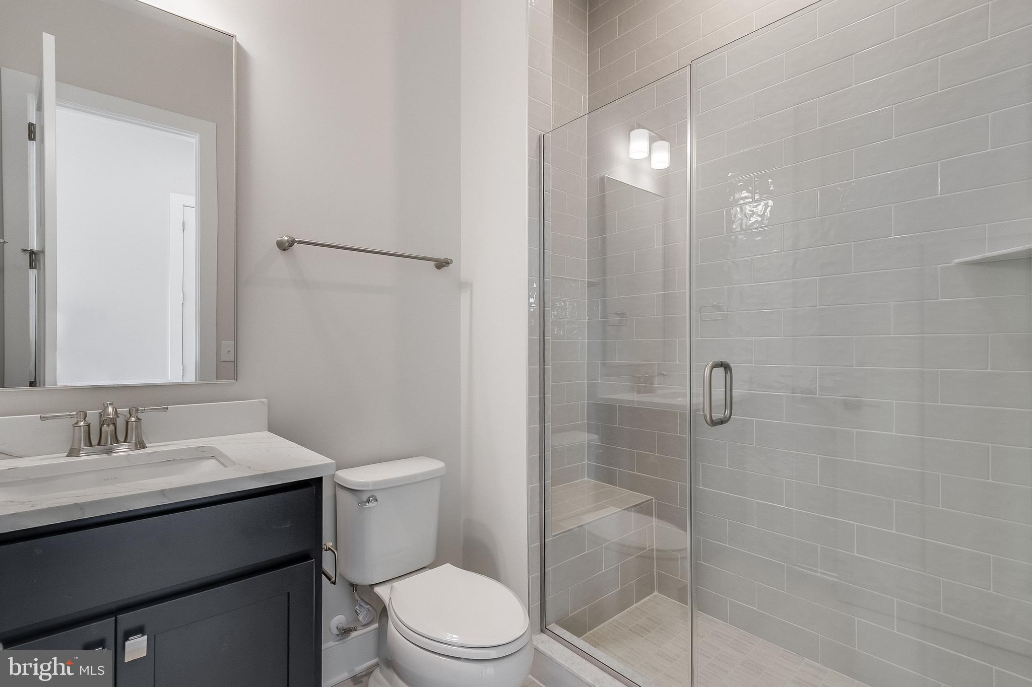 37828 Cedar Road Selbyville, DE 19975 - Photo 61 of 109 a bathroom with a sink a toilet and shower