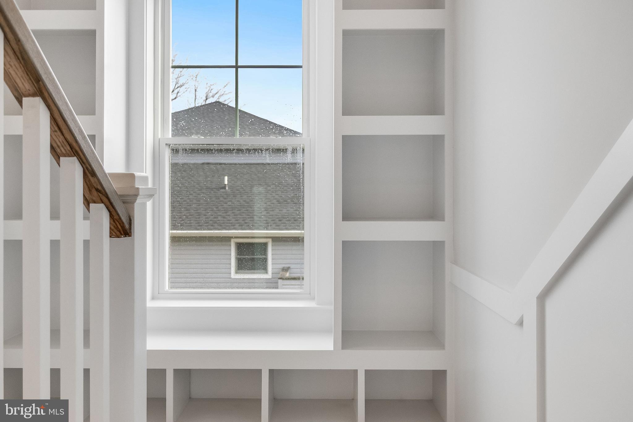 37828 Cedar Road Selbyville, DE 19975 - Photo 71 of 109 Built-in Cabinets in intermediate landing