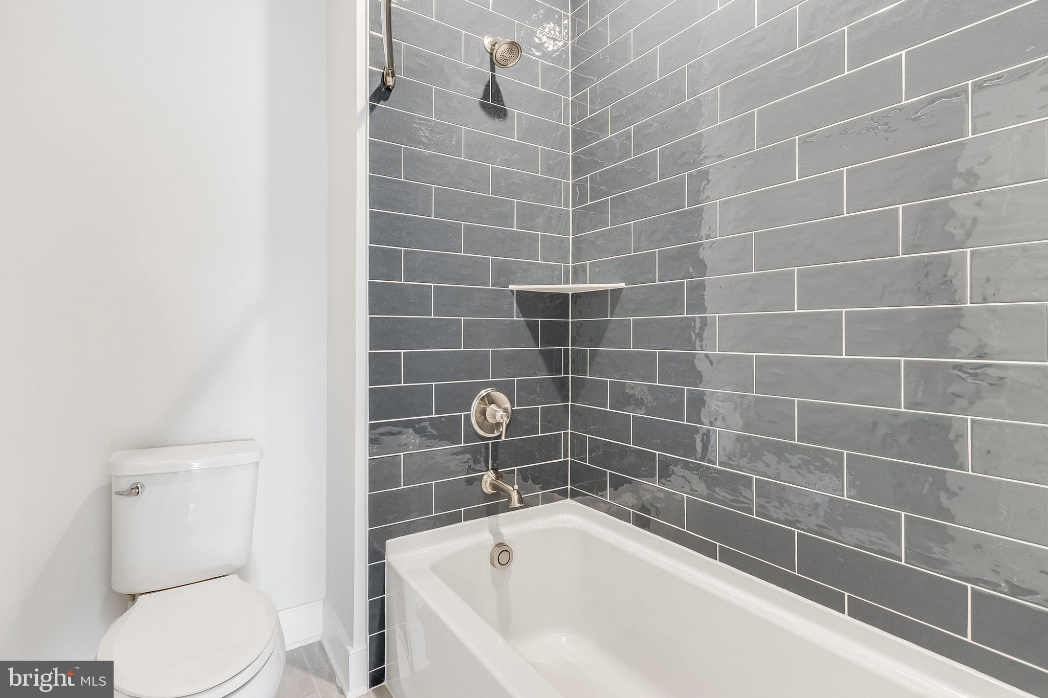 37828 Cedar Road Selbyville, DE 19975 - Photo 97 of 109 a white bath tub sitting next to a white toilet