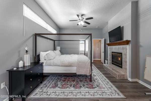 a bed room with a bed and a fireplace