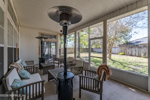 a view of a dining room with furniture window and outside view