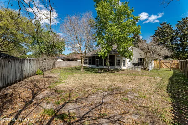 a backyard of a house with lots of green space