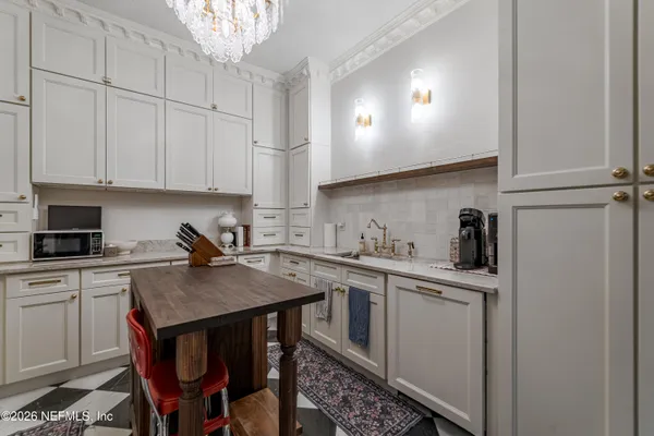 a kitchen with a sink cabinets and window