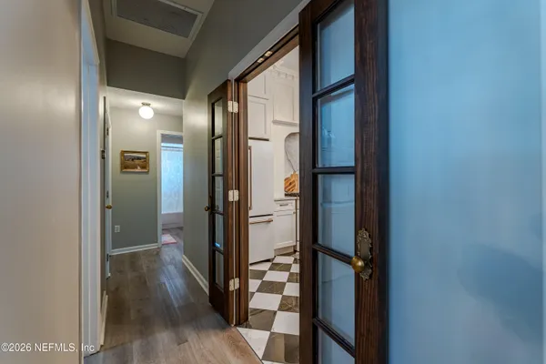 a view of a bathroom from a hallway