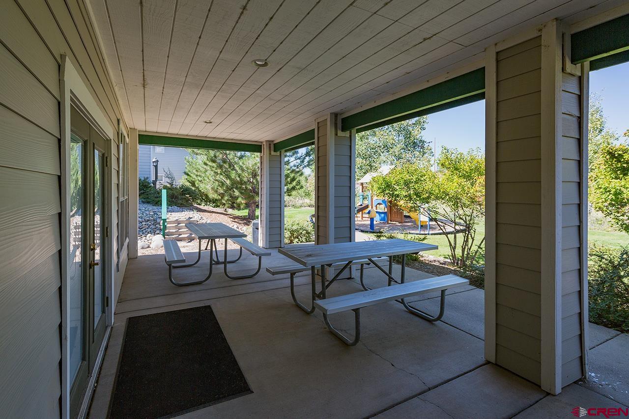 1100 Goeglein Gulch Road, Unit 167 Durango, CO 81301 - Photo 18 of 20 a balcony with furniture and outdoor view
