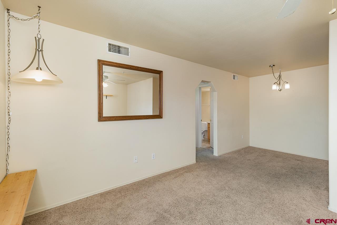 1100 Goeglein Gulch Road, Unit 167 Durango, CO 81301 - Photo 6 of 20 a view of an empty room with a window