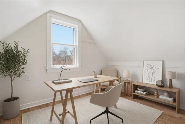 a workspace with furniture and window