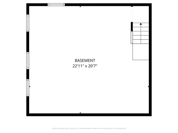 a open living room with a white wall