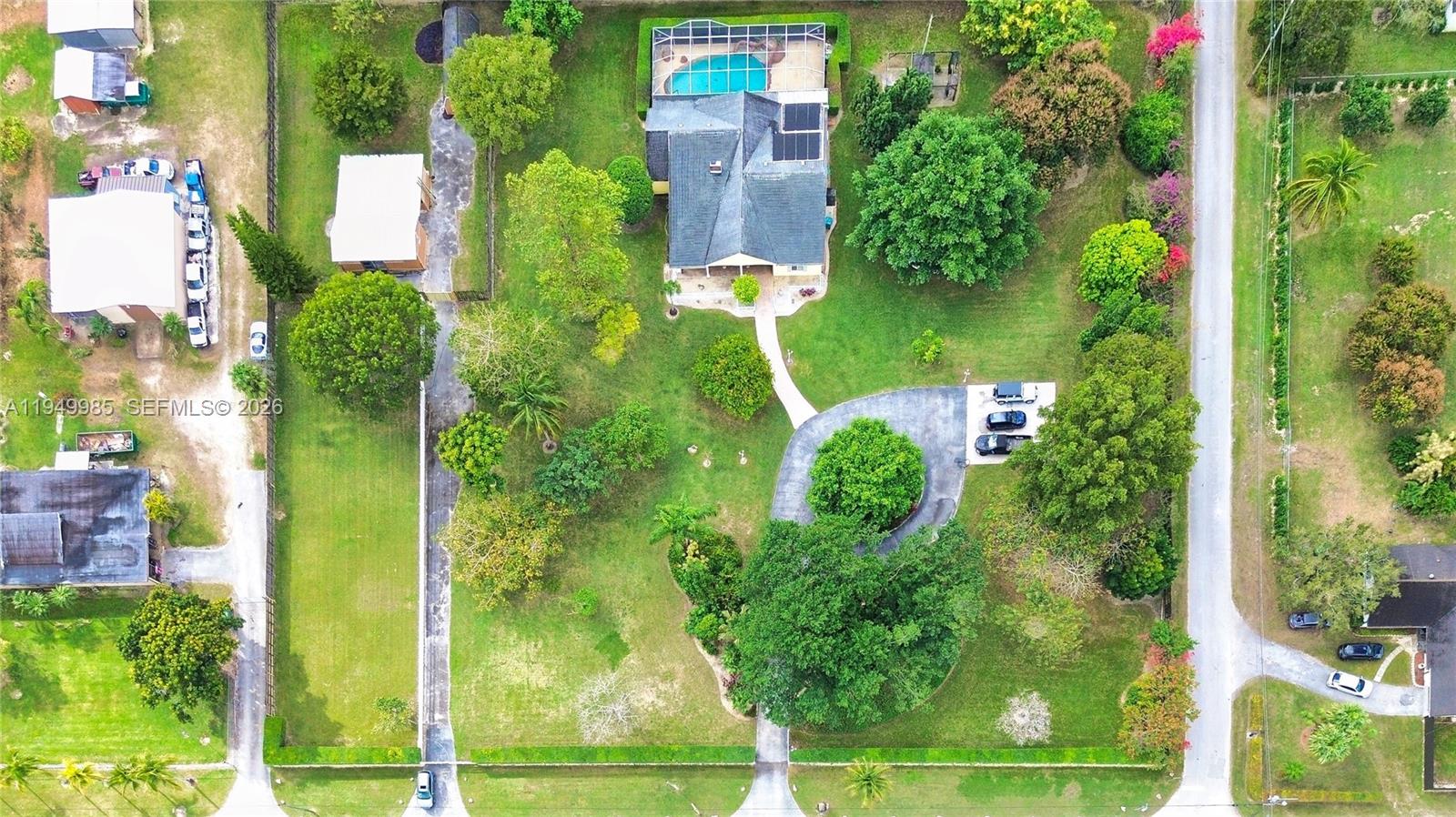 19280 Southwest 304th Street Homestead, FL 33030 - Photo 1 of 57 an aerial view of a residential apartment building with a yard and large trees