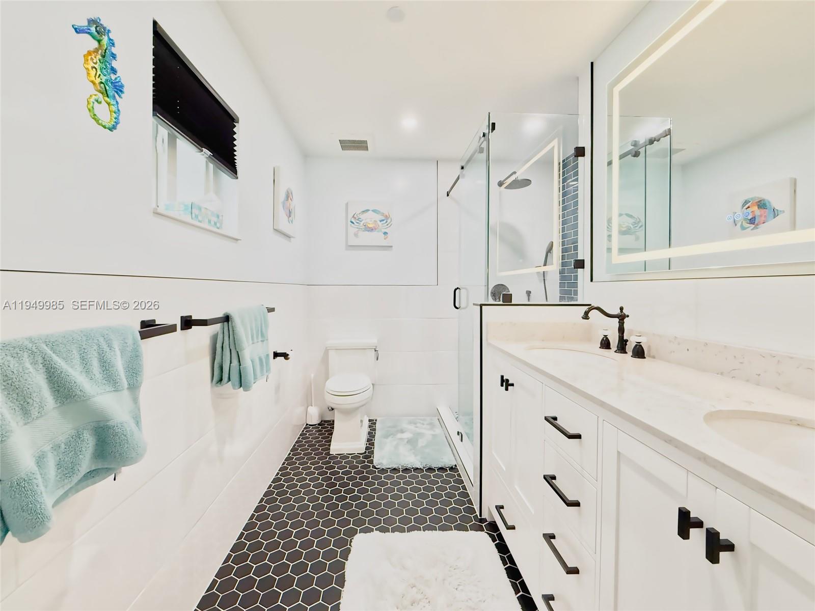 19280 Southwest 304th Street Homestead, FL 33030 - Photo 21 of 57 a bathroom with a sink a toilet and a shower