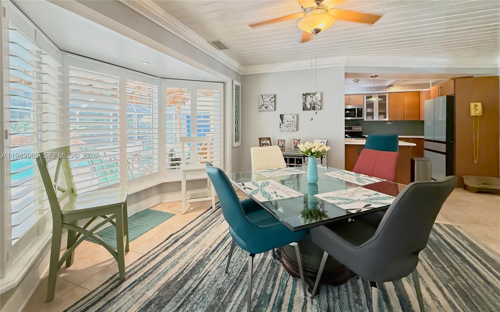 19280 Southwest 304th Street Homestead, FL 33030 - Photo 29 of 57 a view of a dining room with furniture window and outside view