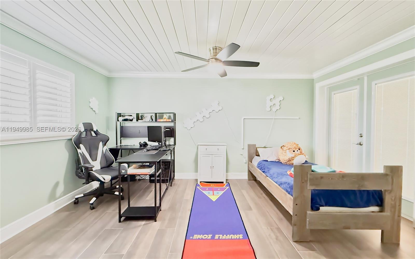 19280 Southwest 304th Street Homestead, FL 33030 - Photo 31 of 57 a bed room with a bed and a chair