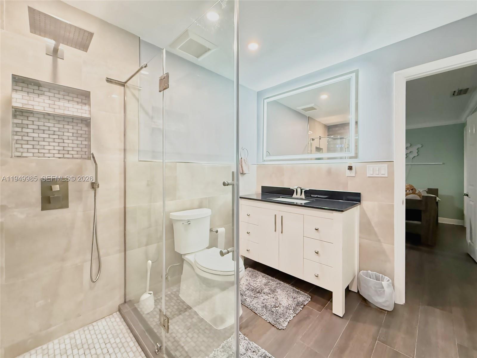 19280 Southwest 304th Street Homestead, FL 33030 - Photo 35 of 57 a bathroom with a sink a toilet and shower