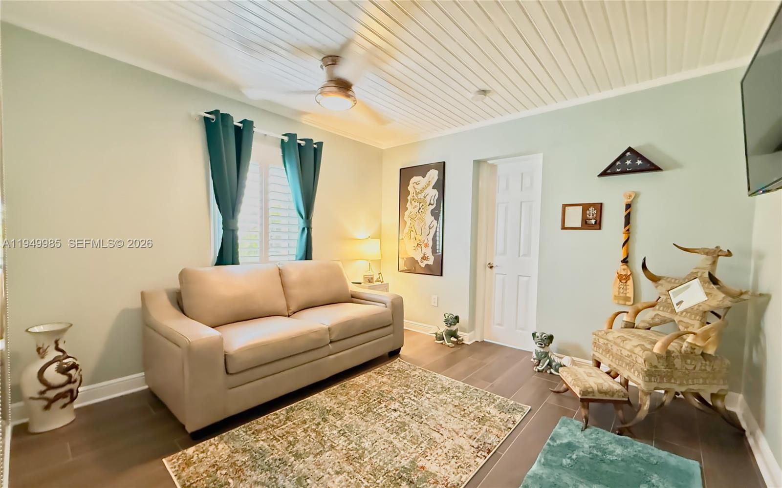 19280 Southwest 304th Street Homestead, FL 33030 - Photo 37 of 57 a living room with furniture and a rug