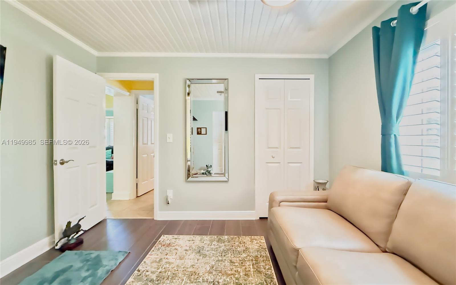 19280 Southwest 304th Street Homestead, FL 33030 - Photo 39 of 57 a living room with furniture and a rug