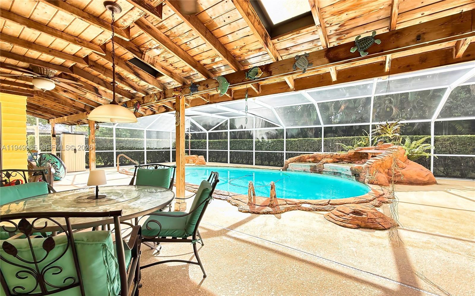 19280 Southwest 304th Street Homestead, FL 33030 - Photo 42 of 57 a view of a chairs and table in the patio