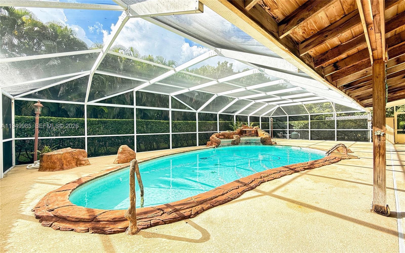 19280 Southwest 304th Street Homestead, FL 33030 - Photo 43 of 57 a view of a backyard with a swimming pool