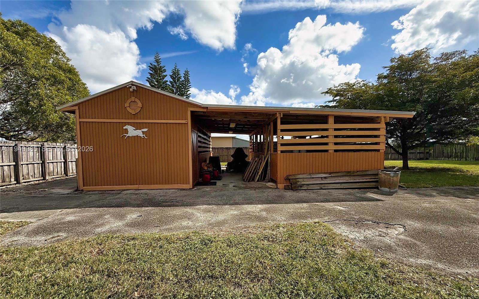 19280 Southwest 304th Street Homestead, FL 33030 - Photo 47 of 57 a side view of a house with a yard