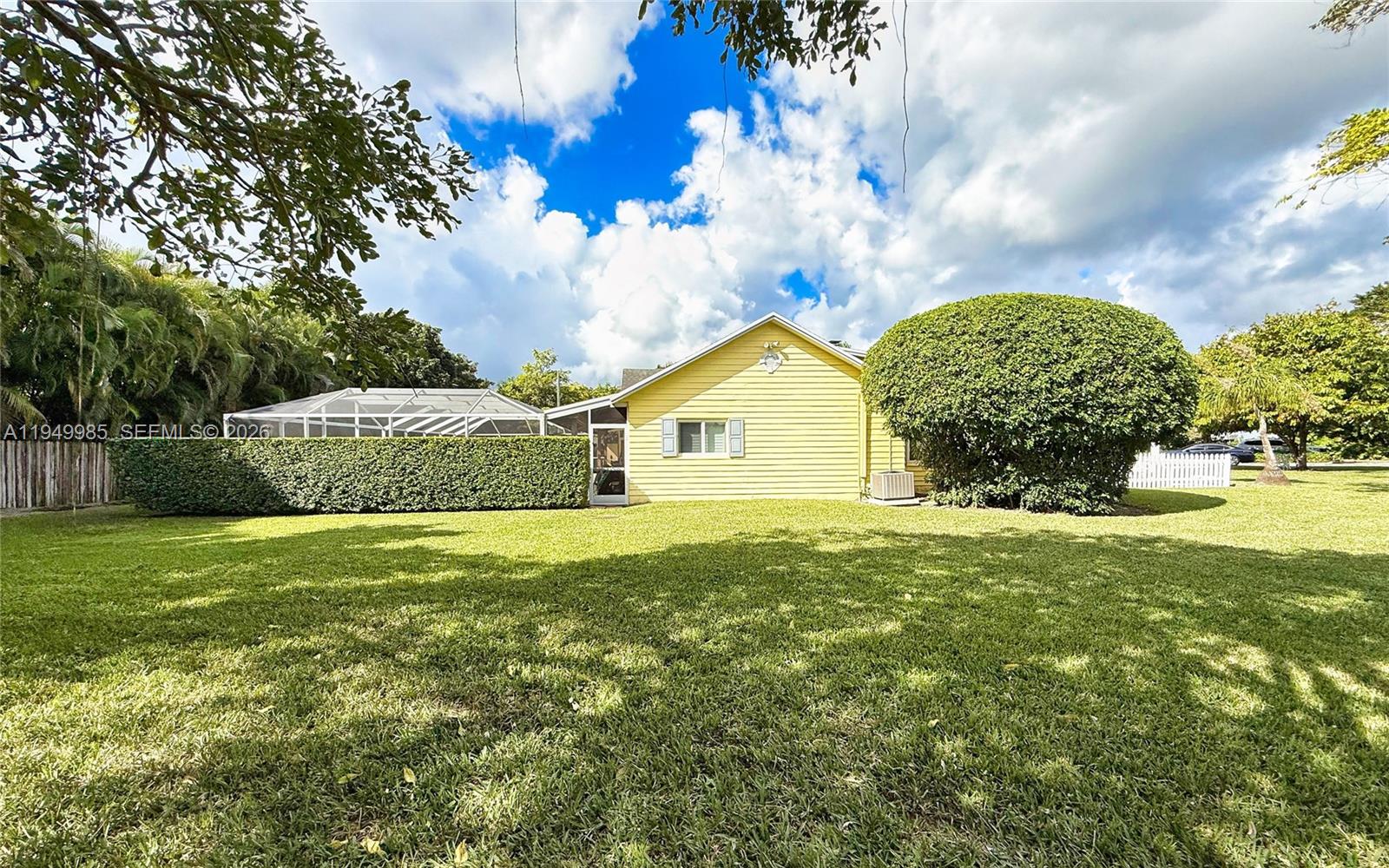 19280 Southwest 304th Street Homestead, FL 33030 - Photo 55 of 57 a front view of a house with garden