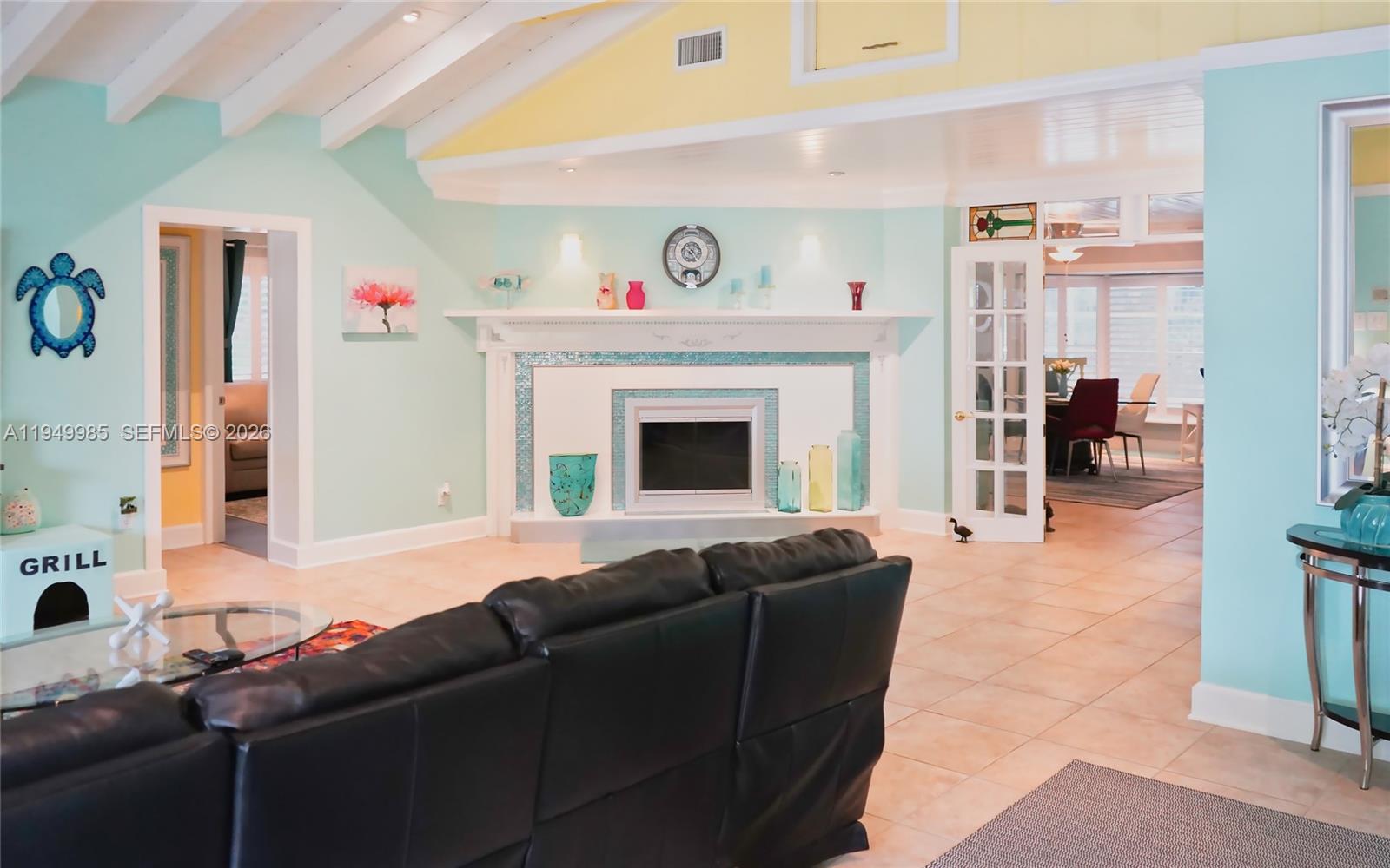 19280 Southwest 304th Street Homestead, FL 33030 - Photo 8 of 57 a living room with furniture and a fireplace