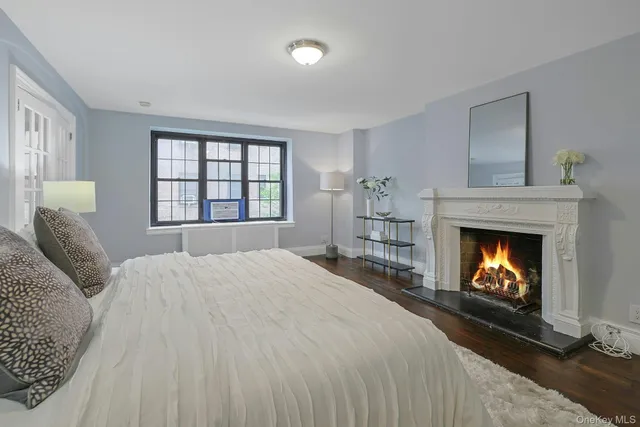 a bedroom with a bed and a fireplace