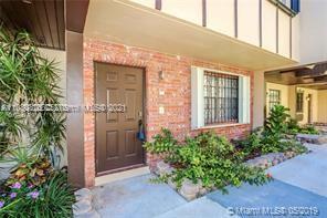 front view of a house with a small yard