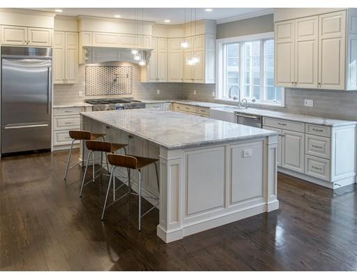 45 Indian Ridge Road Newton, MA 02459 - Photo 3 of 9 a kitchen with kitchen island granite countertop a sink cabinets and stainless steel appliances