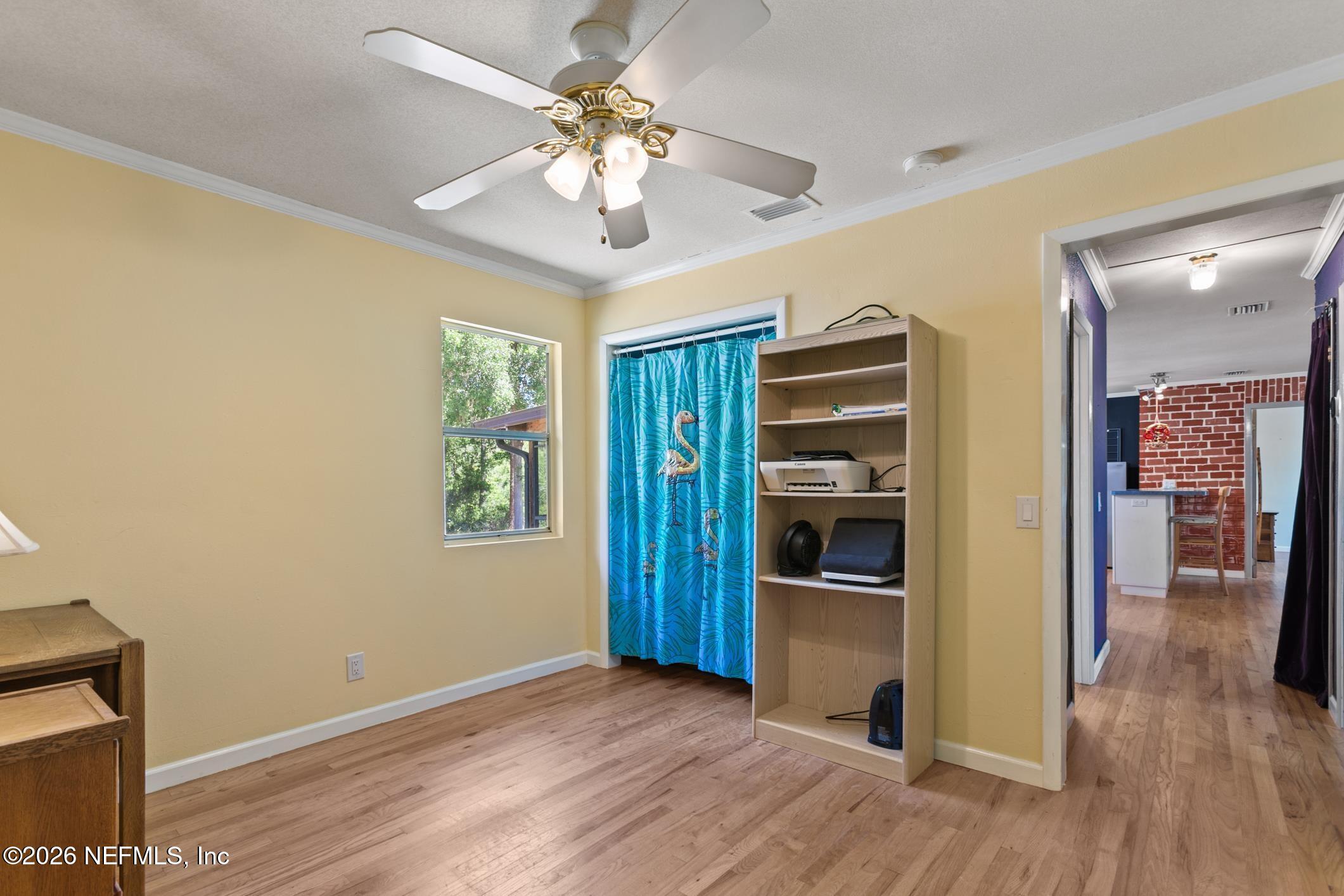 958-954 Grand Rondo Crescent City, FL 32112 - Photo 21 of 29 wooden floor in an empty room with a window