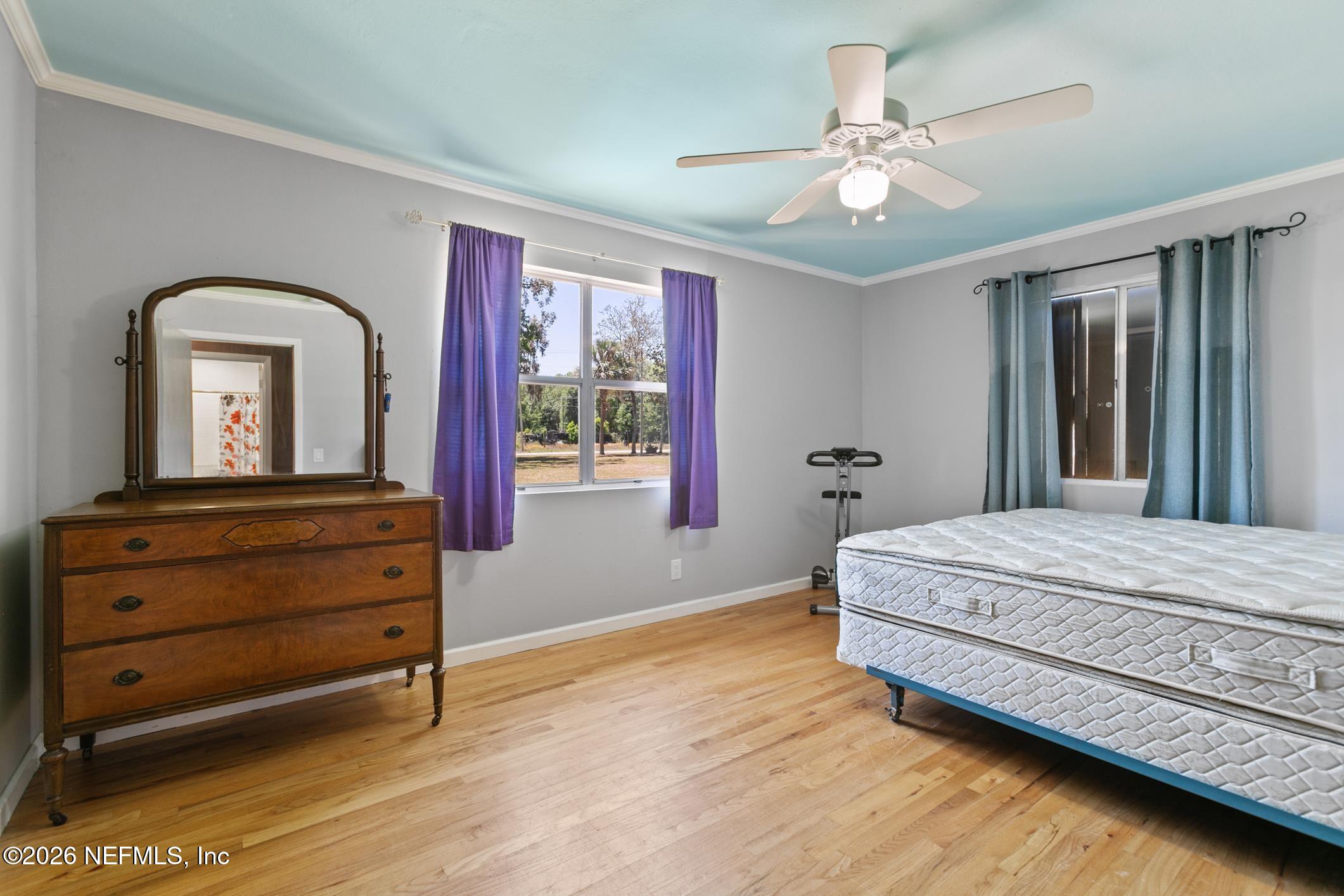958-954 Grand Rondo Crescent City, FL 32112 - Photo 22 of 29 a bedroom with a bed and a dresser