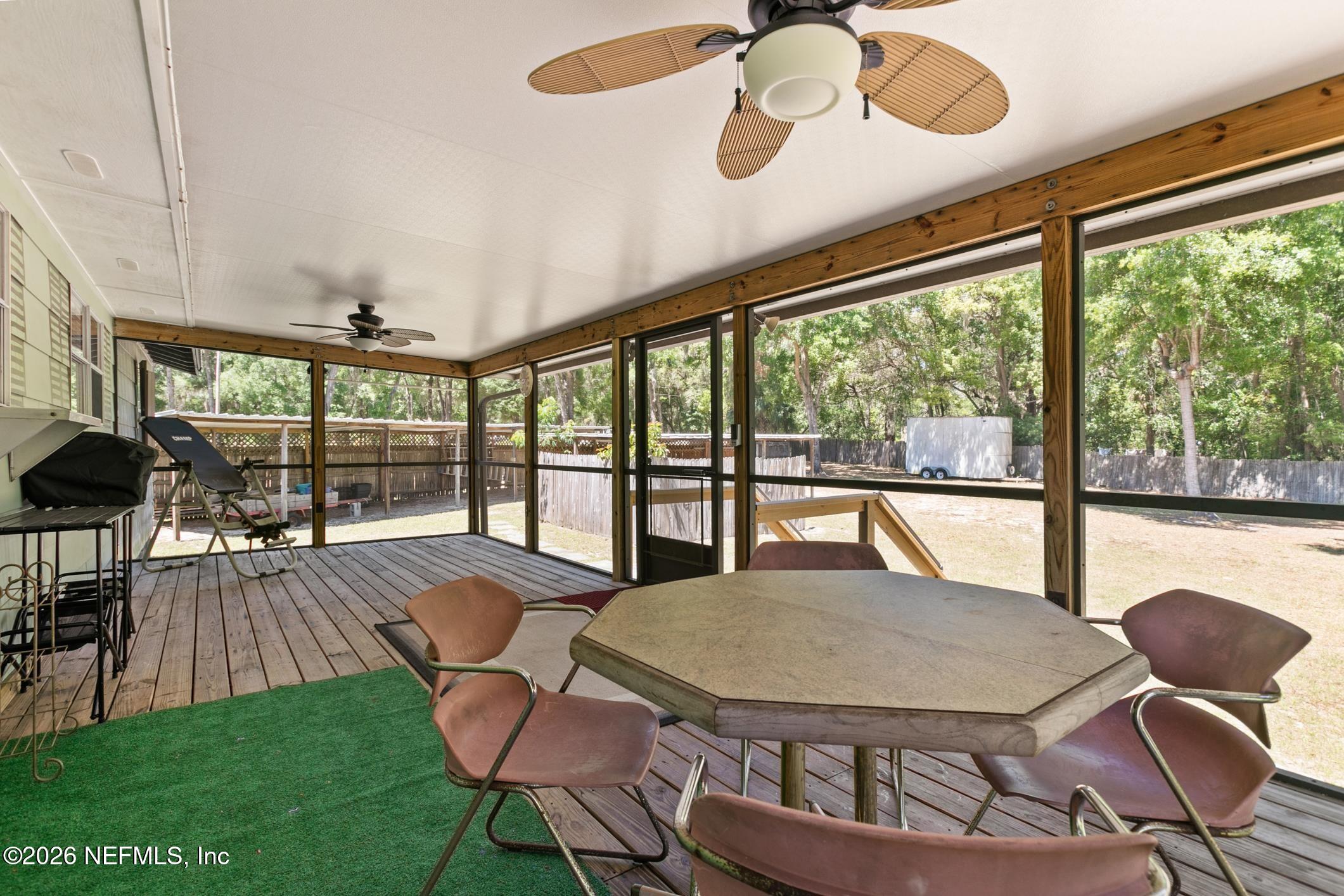 958-954 Grand Rondo Crescent City, FL 32112 - Photo 25 of 29 a view of a dining room with furniture window and outside view