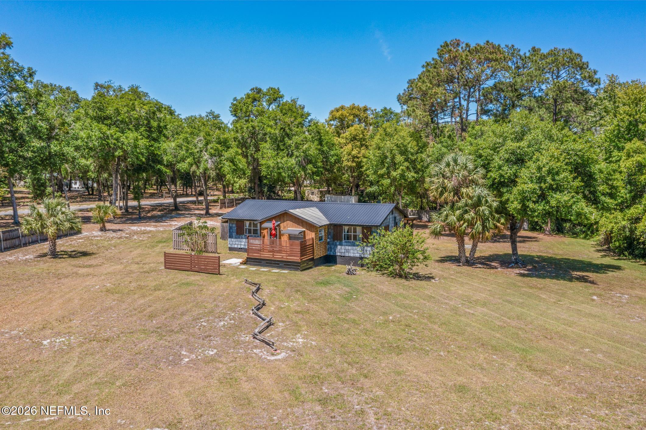 958-954 Grand Rondo Crescent City, FL 32112 - Photo 26 of 29 an outdoor view of a house with basket ball court
