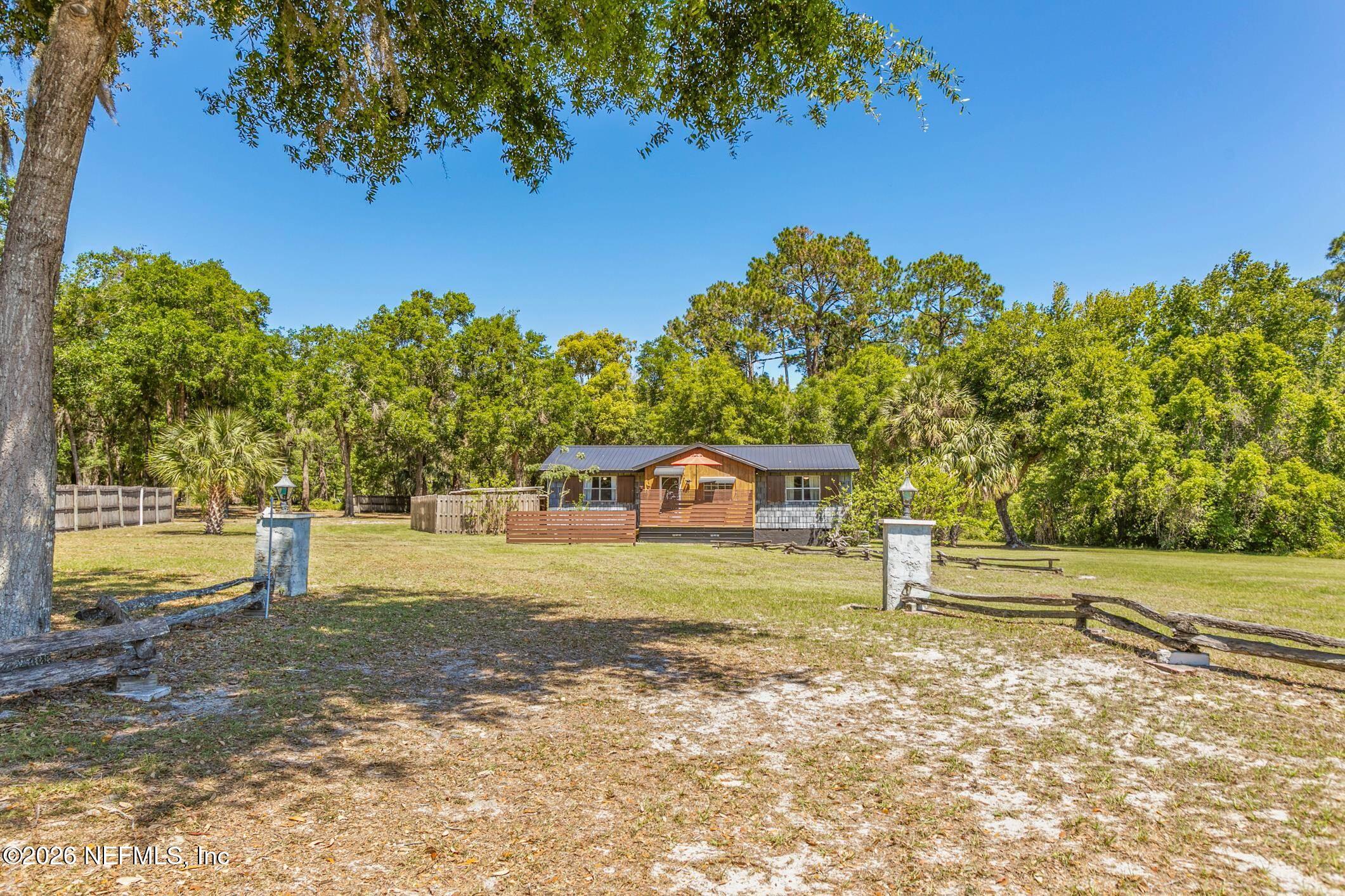 958-954 Grand Rondo Crescent City, FL 32112 - Photo 4 of 29 a front view of a house with a yard