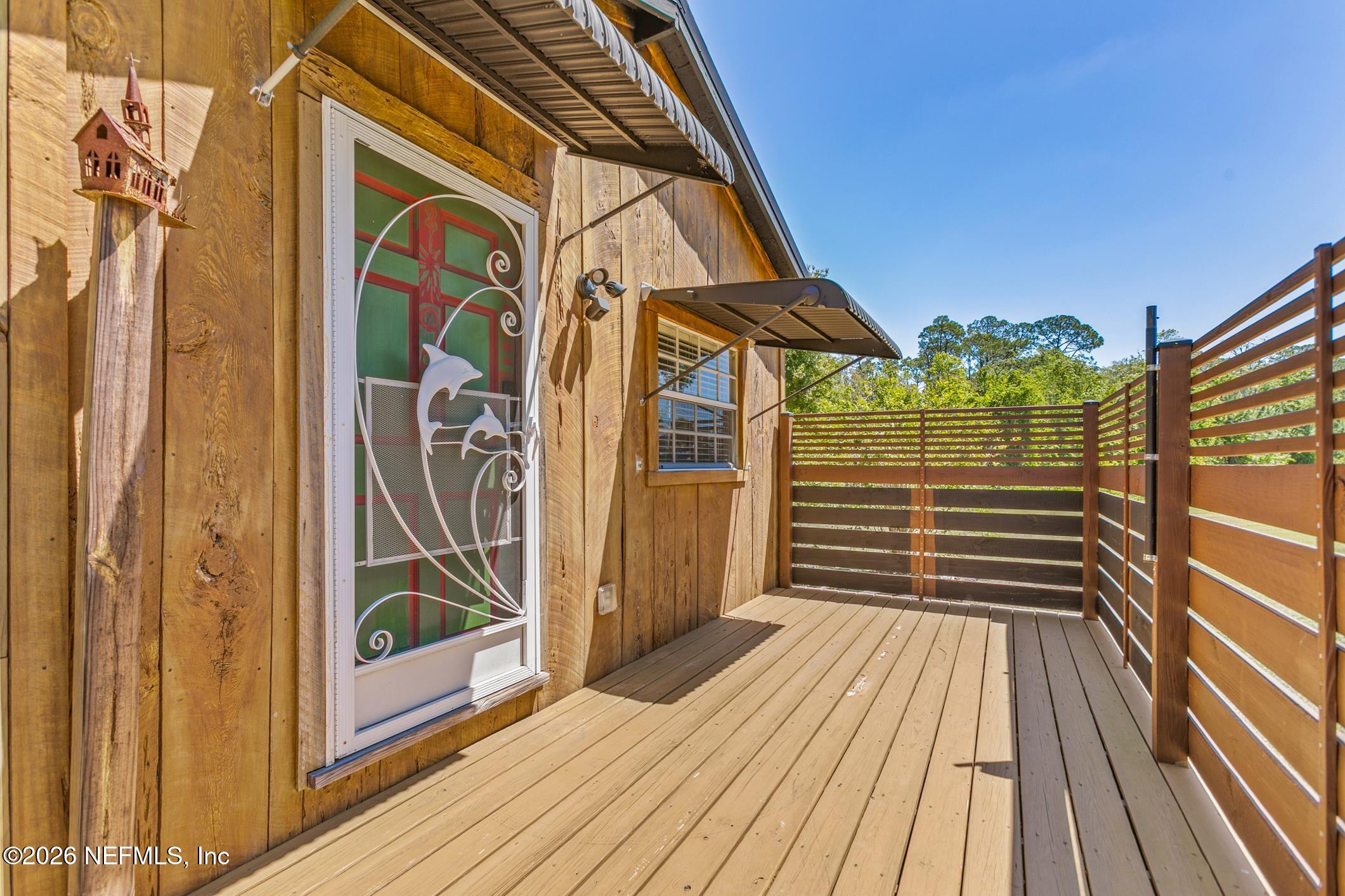 958-954 Grand Rondo Crescent City, FL 32112 - Photo 6 of 29 a view of a house with a door and wooden floor