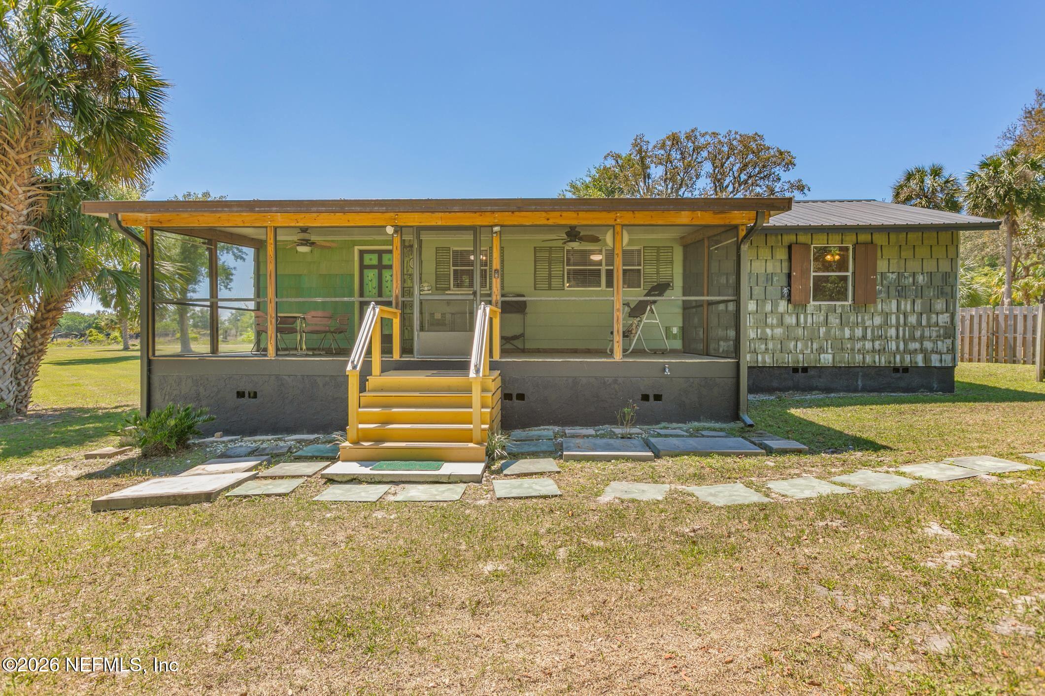 958-954 Grand Rondo Crescent City, FL 32112 - Photo 8 of 29 a house view with swimming pool in front of it