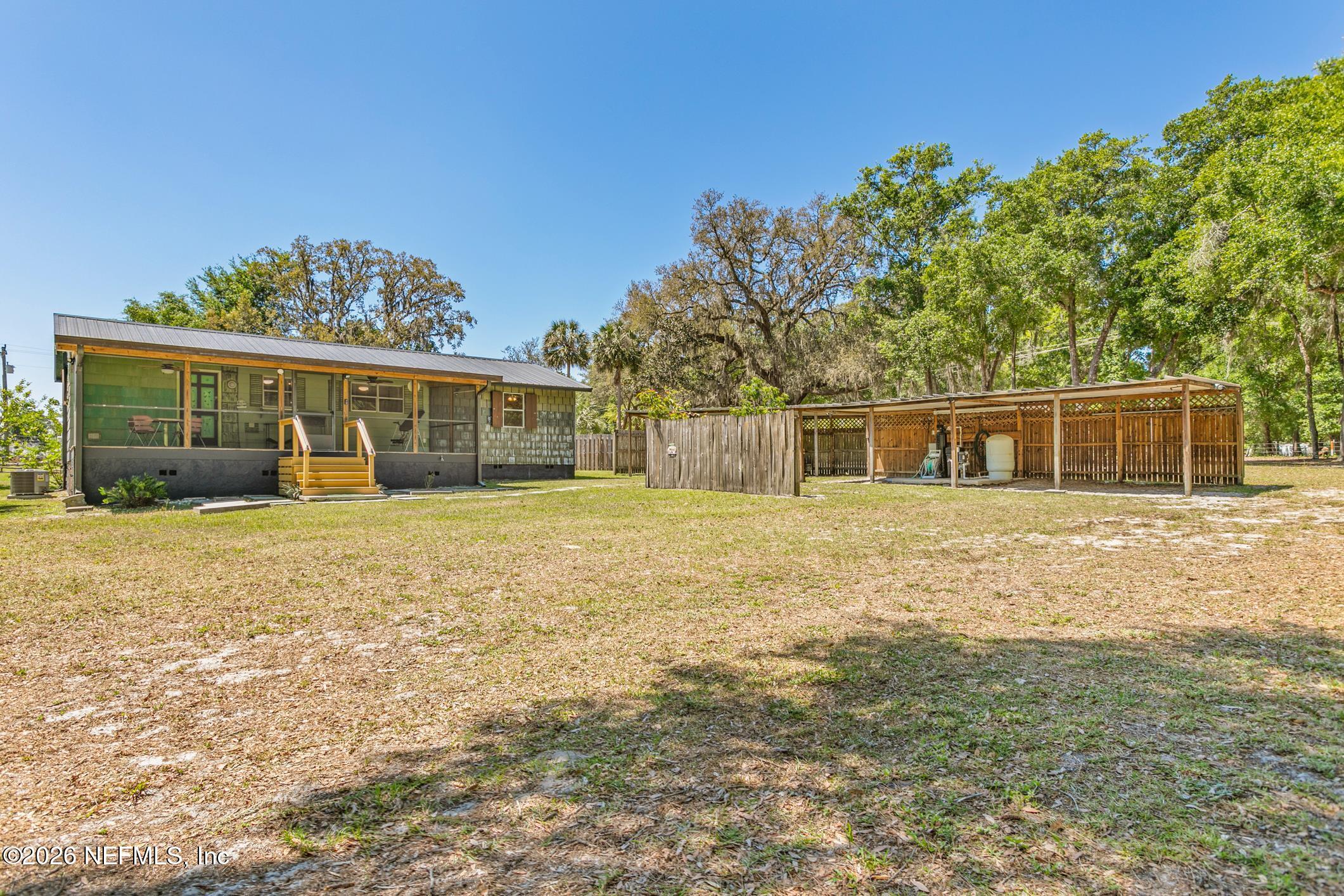 958-954 Grand Rondo Crescent City, FL 32112 - Photo 9 of 29 a front view of a house with a yard