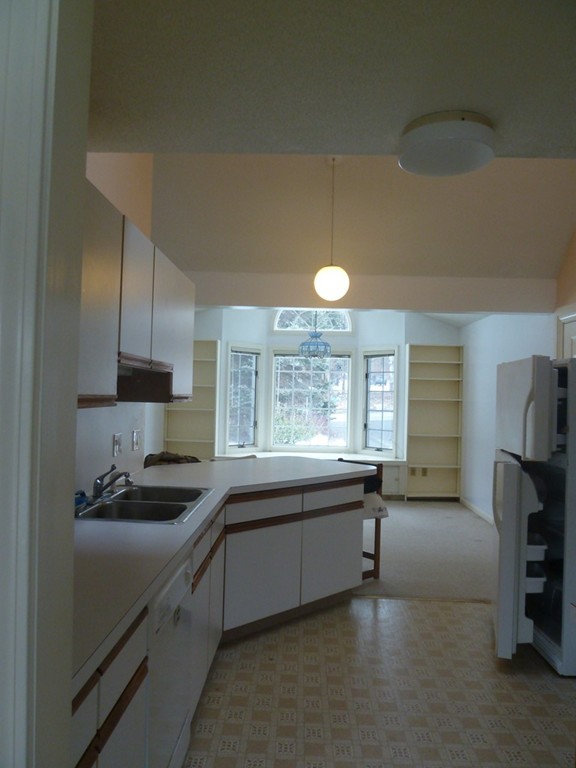 105-107 North Valley Road Pelham, MA 01002 - Photo 12 of 27 a kitchen with a sink cabinets and window