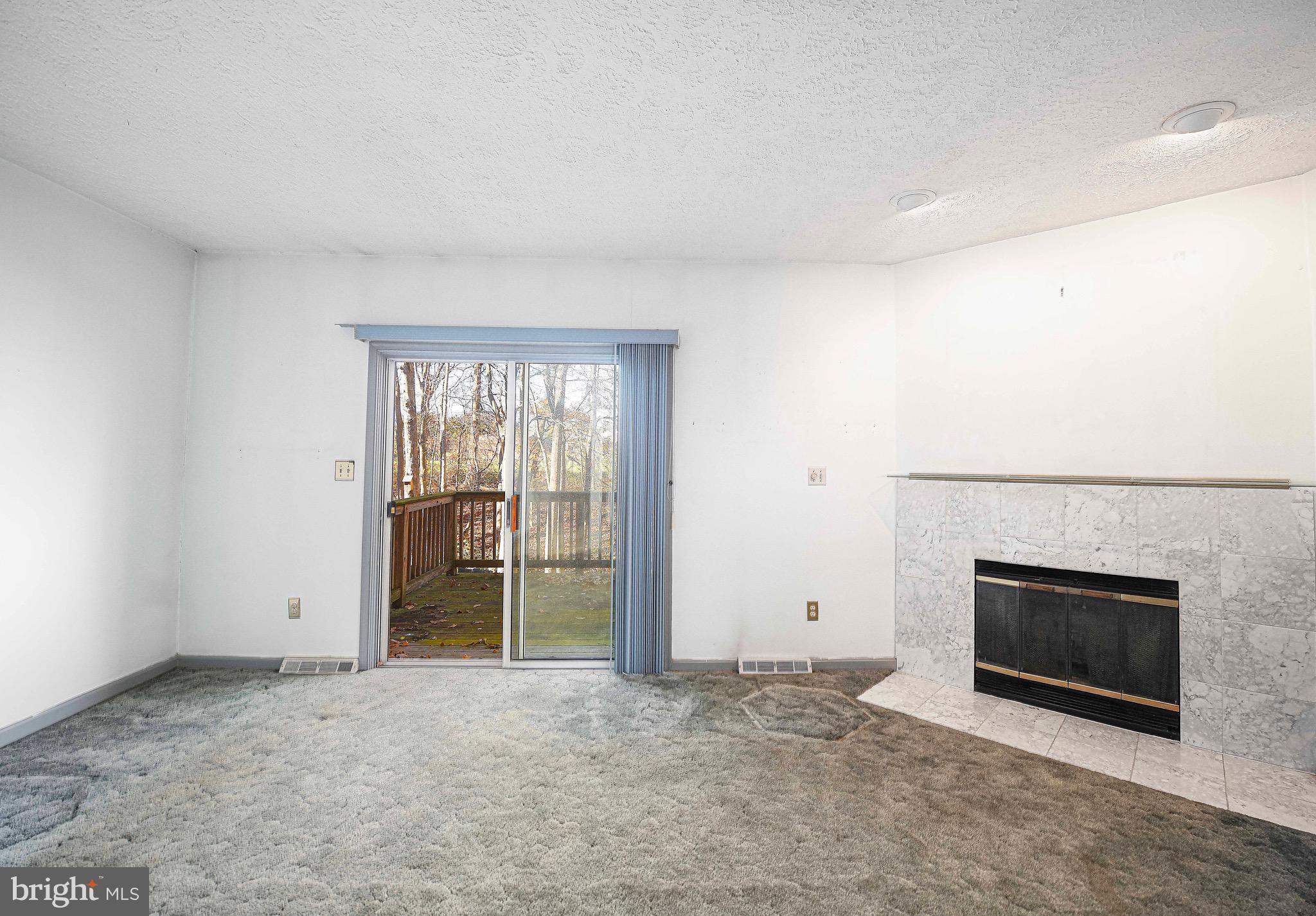 2916 Carlyle Court Abingdon, MD 21009 - Photo 14 of 30 View of living room w/ fireplace & sliders to deck