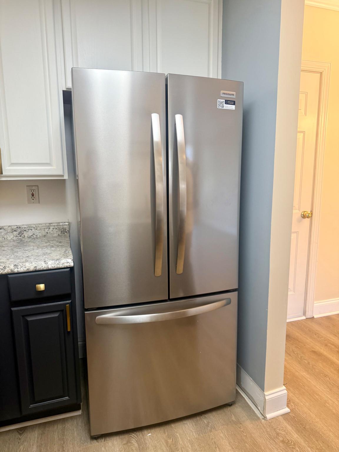 680 Orchard Ridge Drive, Unit 100 Gaithersburg, MD 20878 - Photo 11 of 25 a metallic refrigerator freezer sitting in a kitchen