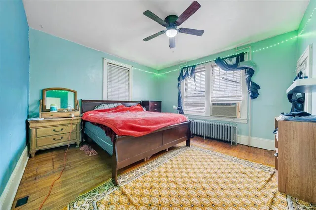 a bedroom with a bed and a table