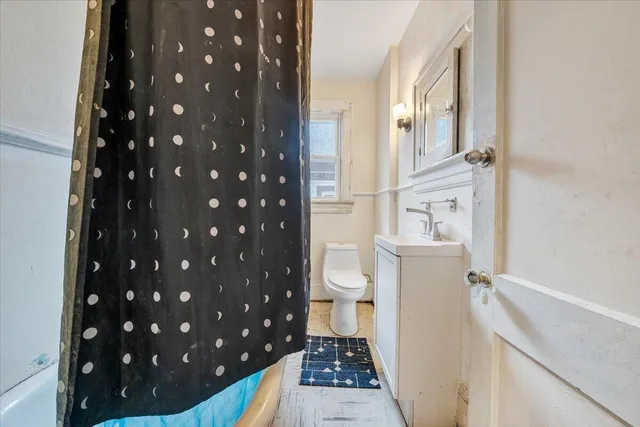 a bathroom with a sink and a toilet