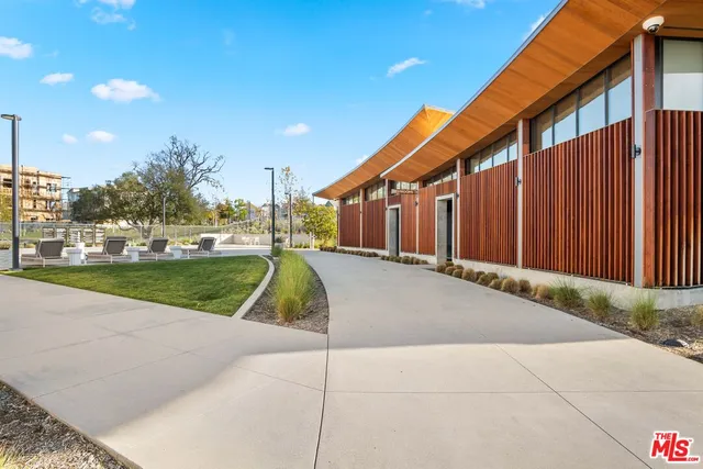 a lobby with furniture and floor to ceiling window