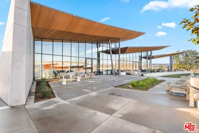 a view of a swimming pool with a lounge chairs