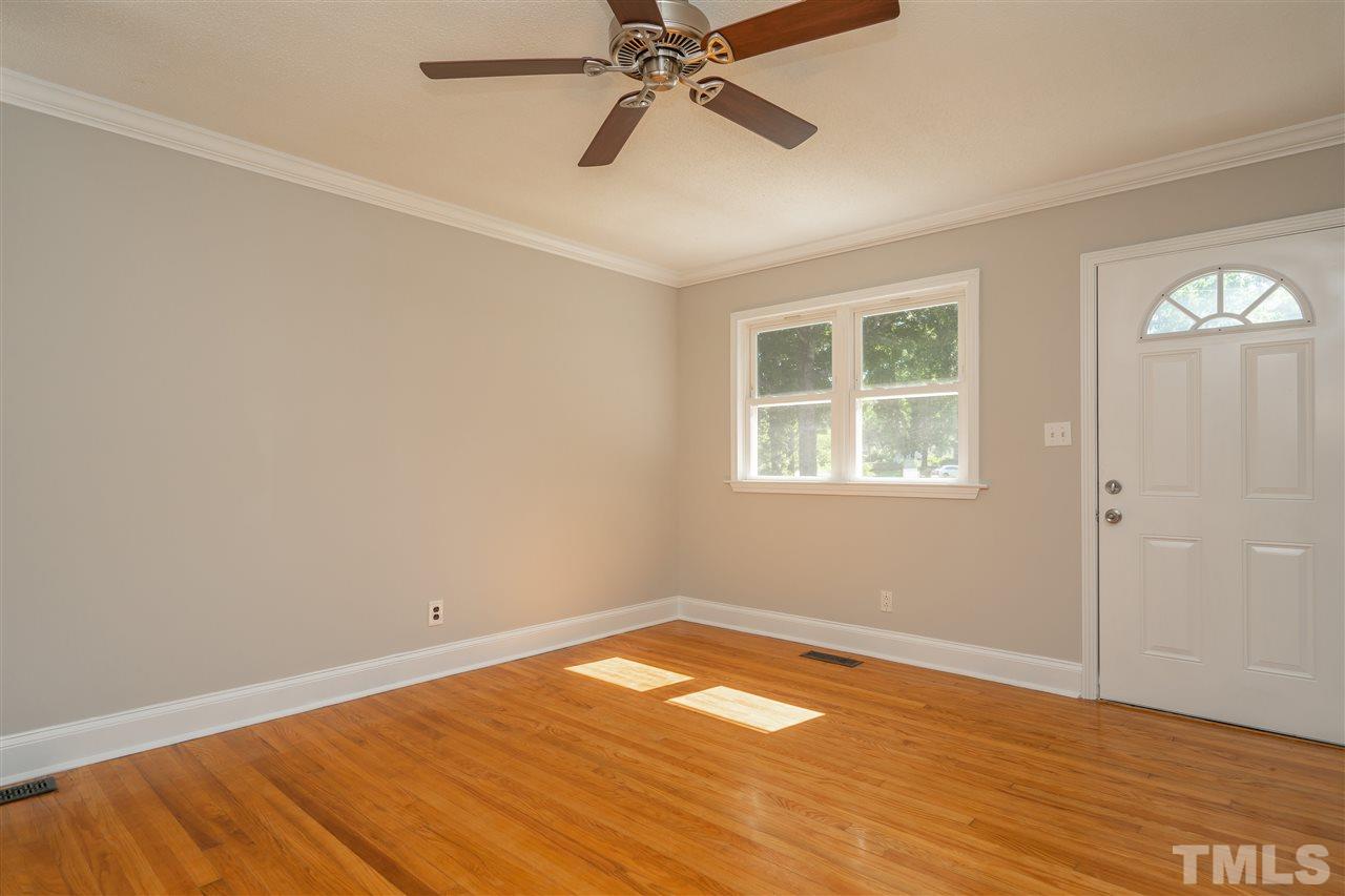 1500 Kelly Road Garner, NC 27529 - Photo 3 of 21 wooden floor in an empty room with a window