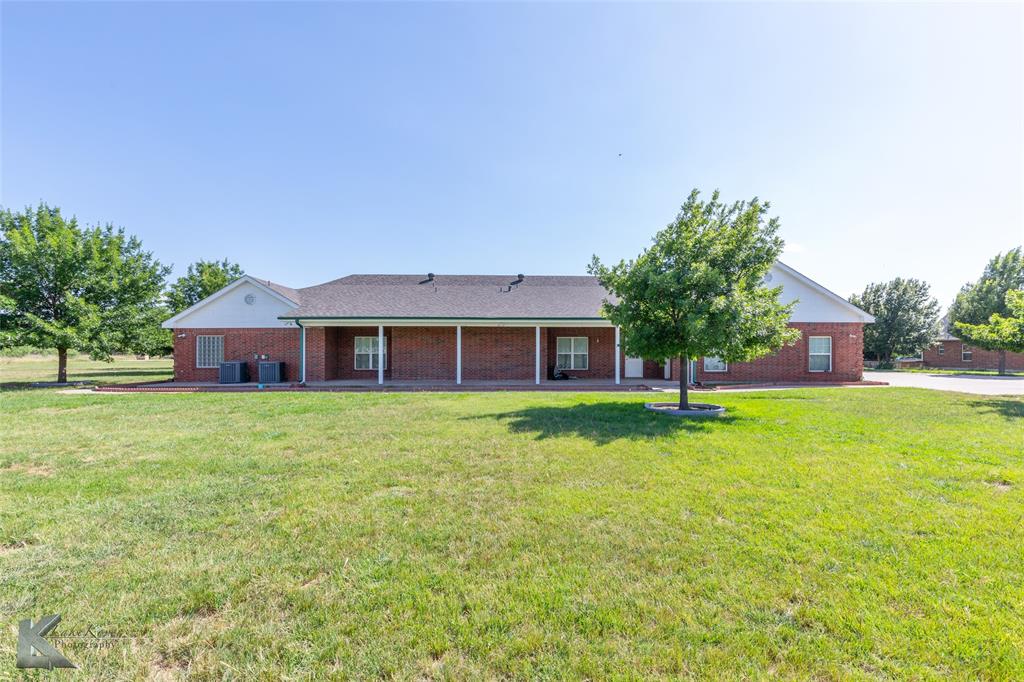 13063 Rainey Ridge Lane Abilene, TX 79602 - Photo 14 of 40 a front view of a house with a garden