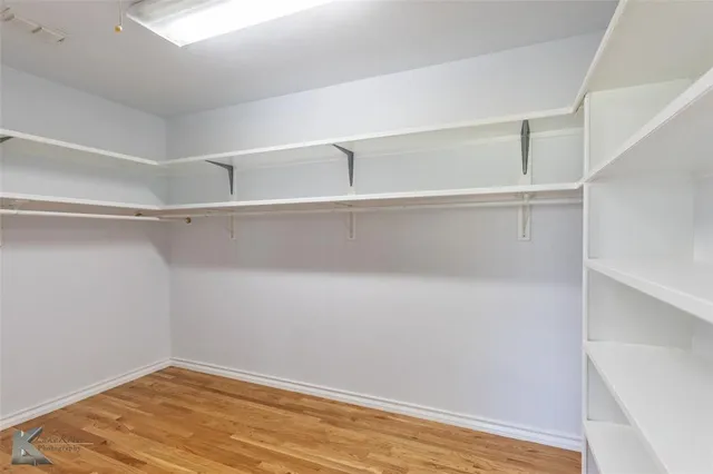 a view of an empty walk in closet