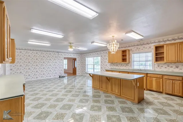 a large bathroom with a large tub sink and double vanity