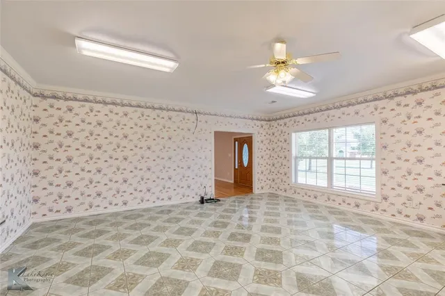 a view of a livingroom with a chandelier fan