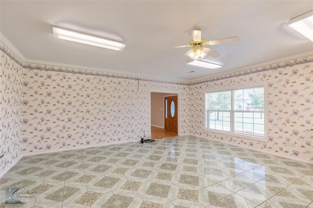 13063 Rainey Ridge Lane Abilene, TX 79602 - Photo 22 of 40 a view of a livingroom with a chandelier fan