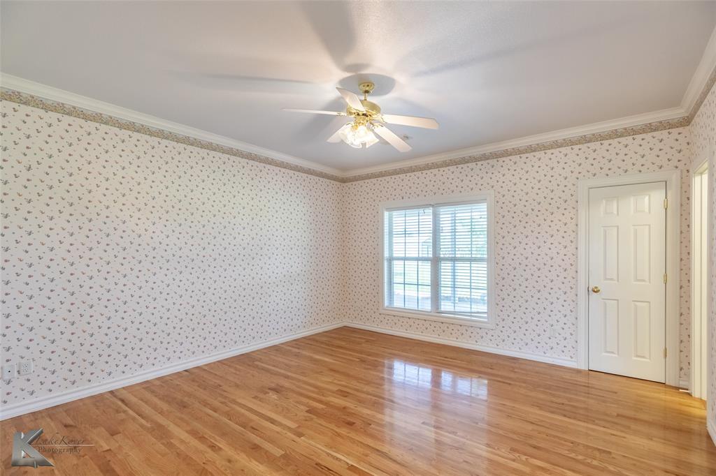 13063 Rainey Ridge Lane Abilene, TX 79602 - Photo 23 of 40 wooden floor in an empty room with a window